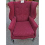 An early 20c Queen Anne design winged armchair upholstered in red est: £100-£150