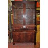 A fine George III mahogany secretaire bookcase with astral glazed doors above a pull out writing