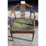 A George III oak country elbow chair with rush seat and loose cushion est: £50-£80