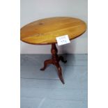 A Victorian satin wood tripod lamp table est: £50-£80