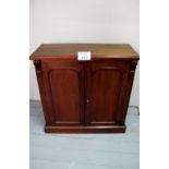 A Victorian walnut two door cupboard with arched panelled doors est: £70-£90