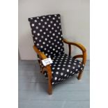 An Art Deco oak framed easy chair upholstered in a black material with circles est: £50-£80