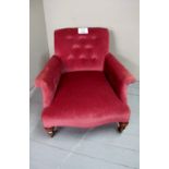 A Victorian buttoned back fireside armchair in good condition est: £50-£80