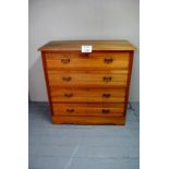 An Edwardian satin wood chest of four long drawers with brass handles est: £70-£100