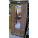 A late Victorian satinwood single wardrobe with a mirrored door est: £50-£100