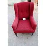 A 19c winged armchair upholstered in red est: £50-£80