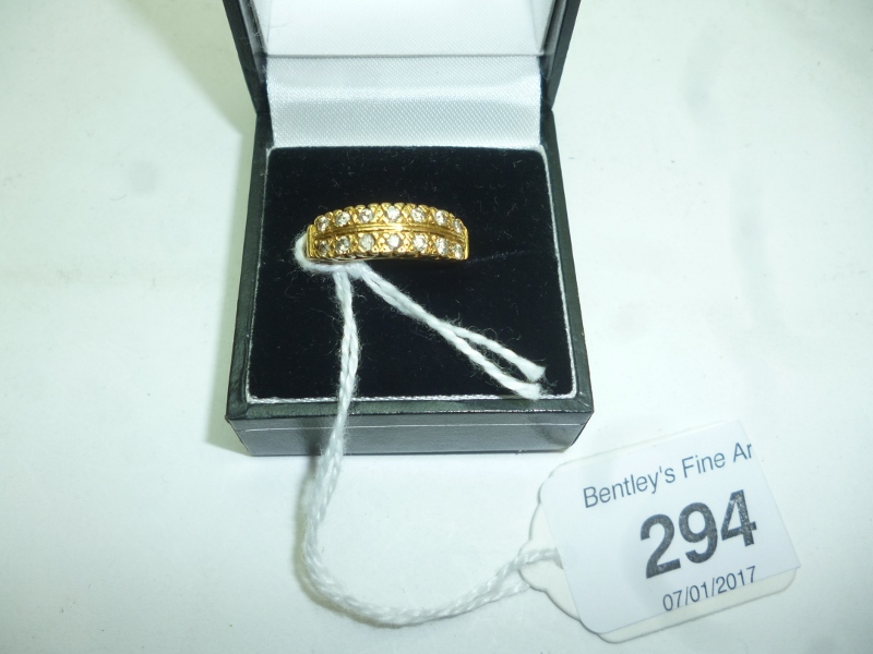 An 18ct gold ring inset with two bands o
