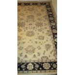 A mid 20c rug on cream ground (238 x 160