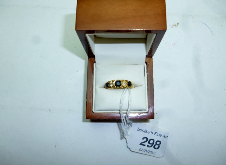 An 18ct gold topaz and diamond ring (siz