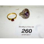 An amethyst ring and a garnet ring both