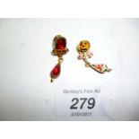 A pair of enamelled drop earrings inset