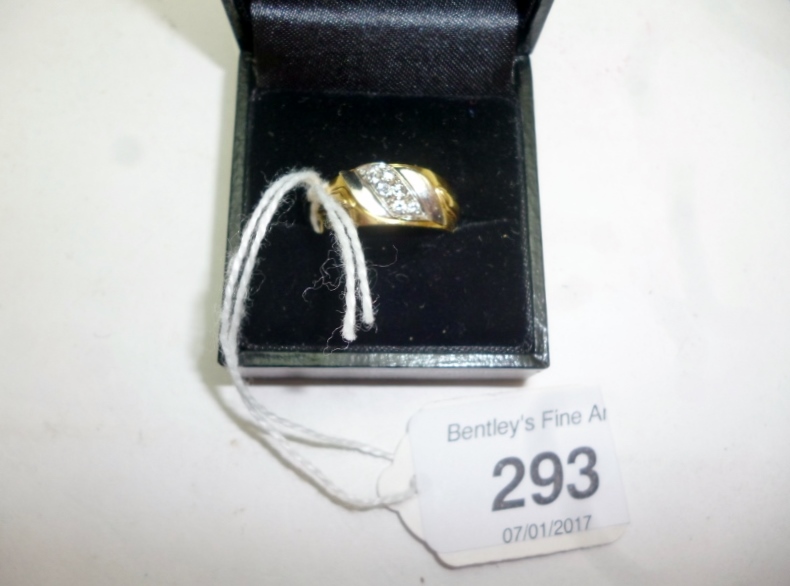 An 18ct gold ring inset with band of six