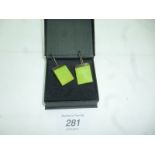 A pair of green glass designer earrings