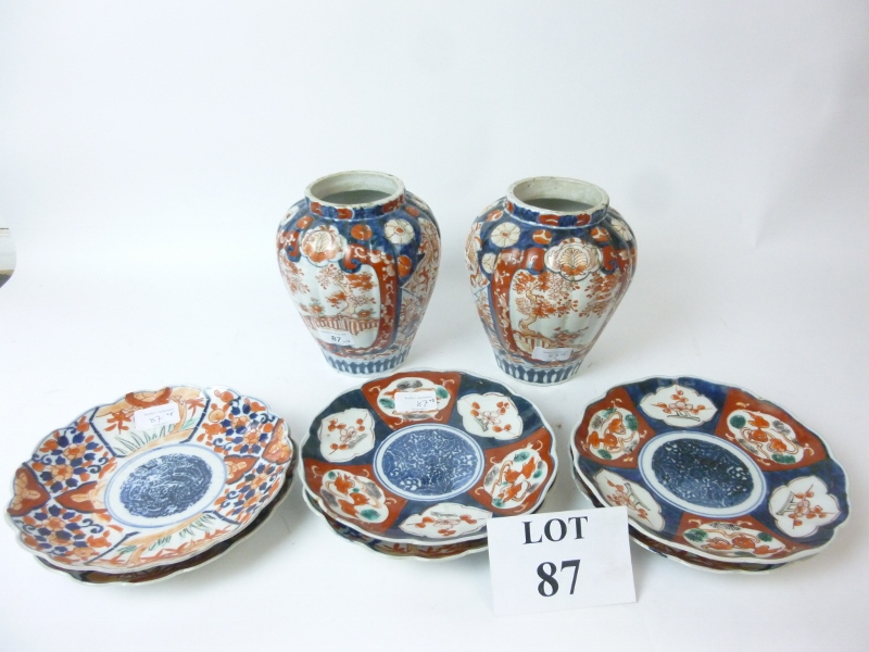 A pair of Imari palate ribbed vases and