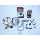 An assortment of items to include a 9ct gold ewer charm,