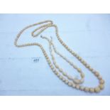 Two graduated ivory necklaces (one approx 40" long) est: £40-£70