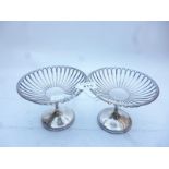 A pair of silver tazza's with open work sides London 1909 est: £200-£300