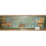 Golfing interest: a large glazed case titled 'The History of Golf' and containing replica clubs and