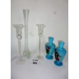 A pair of blue glass vases; a tall lily or amaryllis stem vase;