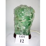 An Oriental carved green 'quartz' table lamp,