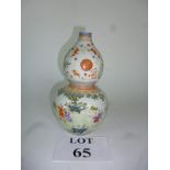 A Chinese double gourd vase painted with children in a garden in Famille rose enamels est: £80-£120