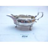 A silver sauce boat with acanthus leaf double scroll handle London 1899 est: £80-£120