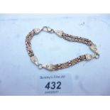 A 9ct gold bracelet inset with six diamonds est: £200-£300