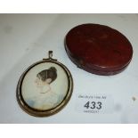 An oval framed miniature of a lady with a coral necklace cased est: £50-£80