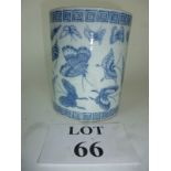 A large blue and white brush pot decorated with butterfly specimens,