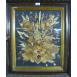 A framed and glazed dried flower arrangement bearing mono 'B.