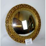 A decorative gilt convex mirror est: £25-£45 (C)