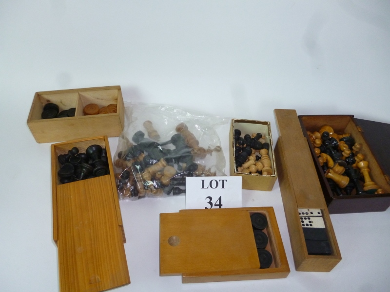 A box of assorted chess sets,