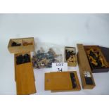 A box of assorted chess sets,