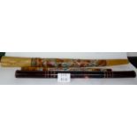 A decorative aboriginal didgeridoo and two rain shaker sticks est: £30-£50 (J)