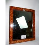 A decorative red and gilt painted wall mirror est: £30-£50 (E)