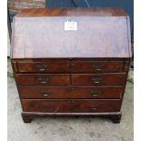 An 18c burr walnut writing bureau with fitted interior over a long drawer two short drawers and two