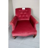 A Victorian buttoned back fireside armchair in good condition est: £40-£60