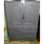 An early 20c painted linen press with cupboards above drawers est: £250-£350