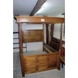 A solid oak double four poster bed in good condition est: £400-£600