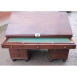 A fine quality 19c Georgian architect's desk with sloping top over a fitted top drawer and short