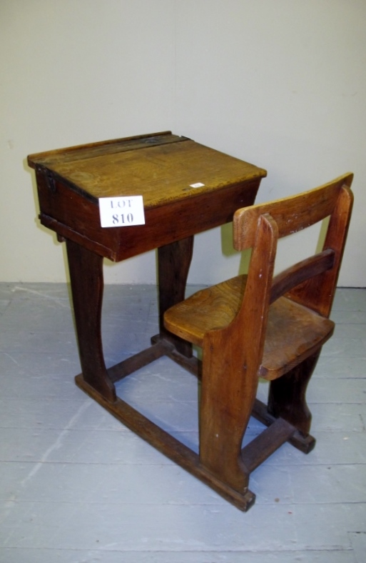An old oak school desk with built in seat est: £30-£50
