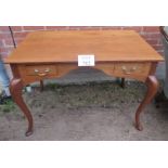 A c1900 mahogany writing table/desk with two short drawers over cabriole legs est: £100-£200