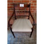 A Regency mahogany elbow chair with crea