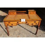 A Victorian walnut desk with three leath