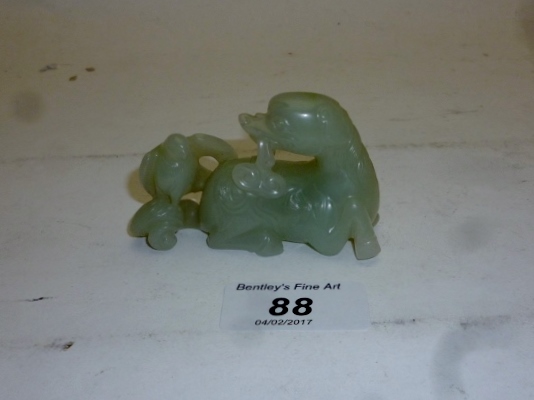 A Chinese white jade dog and bird est: £