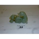 A Chinese white jade dog and bird est: £