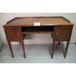 An Edwardian mahogany desk with gallery