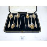 A set of six silver teaspoons and matchi