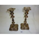 A pair of silver candlesticks (approx 10