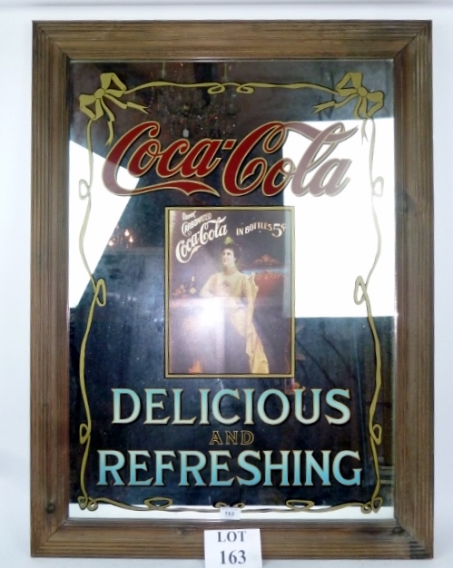 A large decorative framed advertising mi